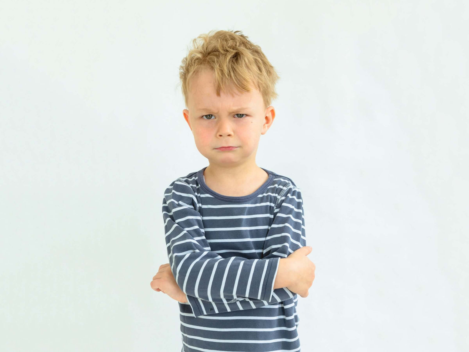 angry boy with arms crossed