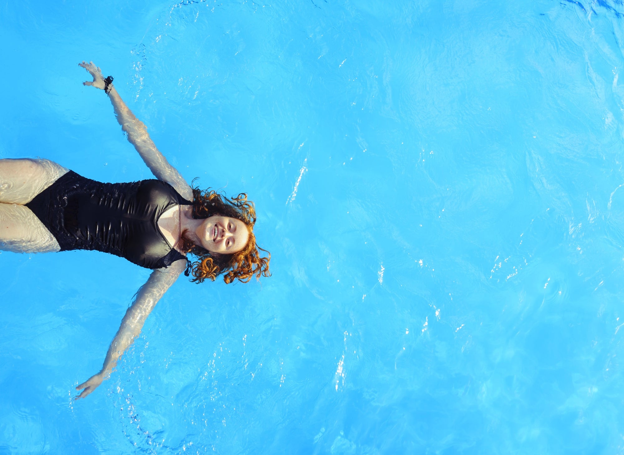 A woman swimming in a pool