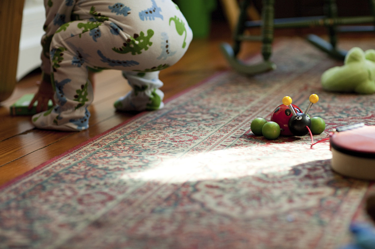 Toddler and toys in living room