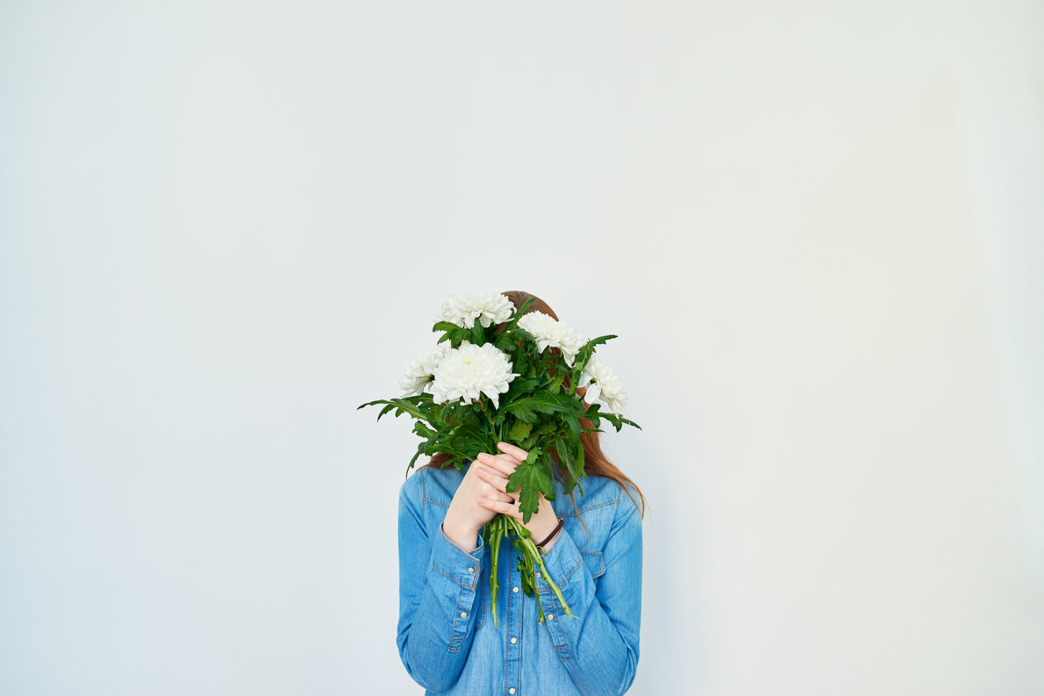 lady Covering Her Face with Flowers