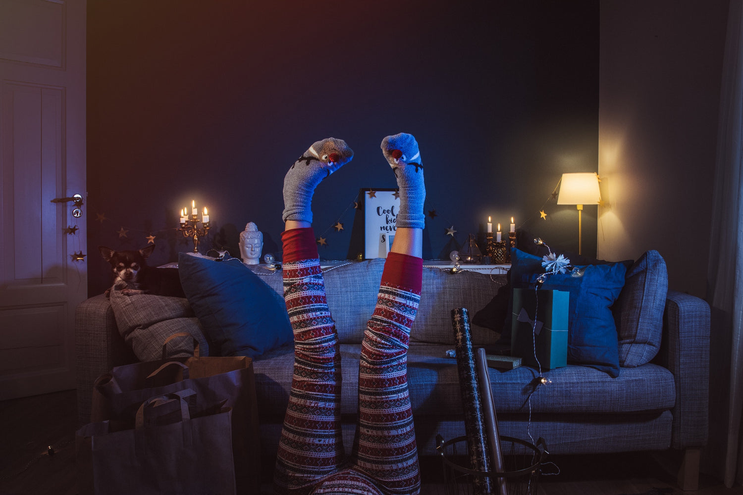 upside down image of women leg's wearing flowered maroon pants and grey socks