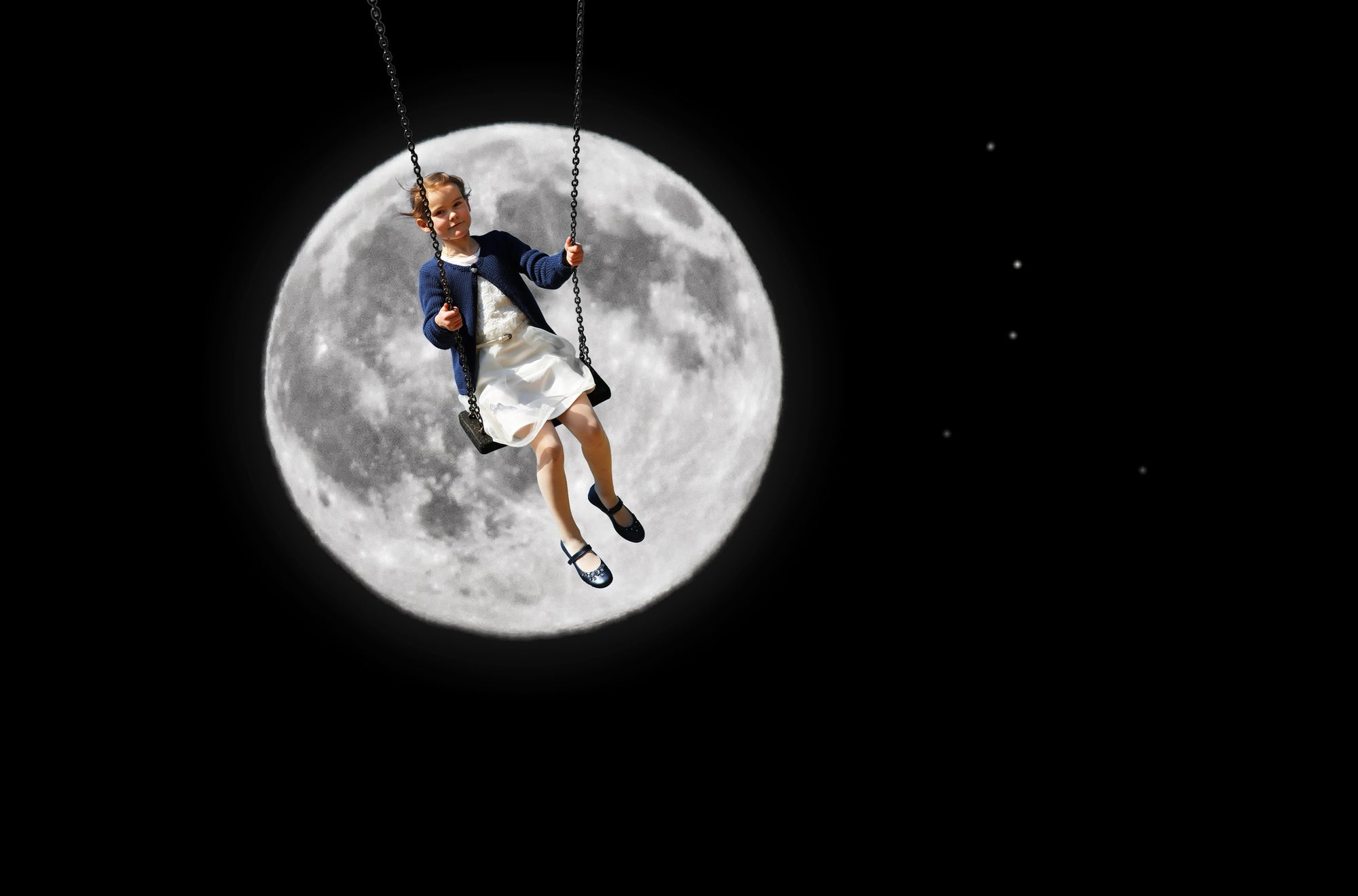 Girl on swing with moon on background