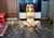 little girl eating snacks off the floor