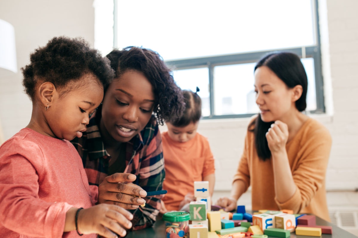 parents playing indoor games with kids