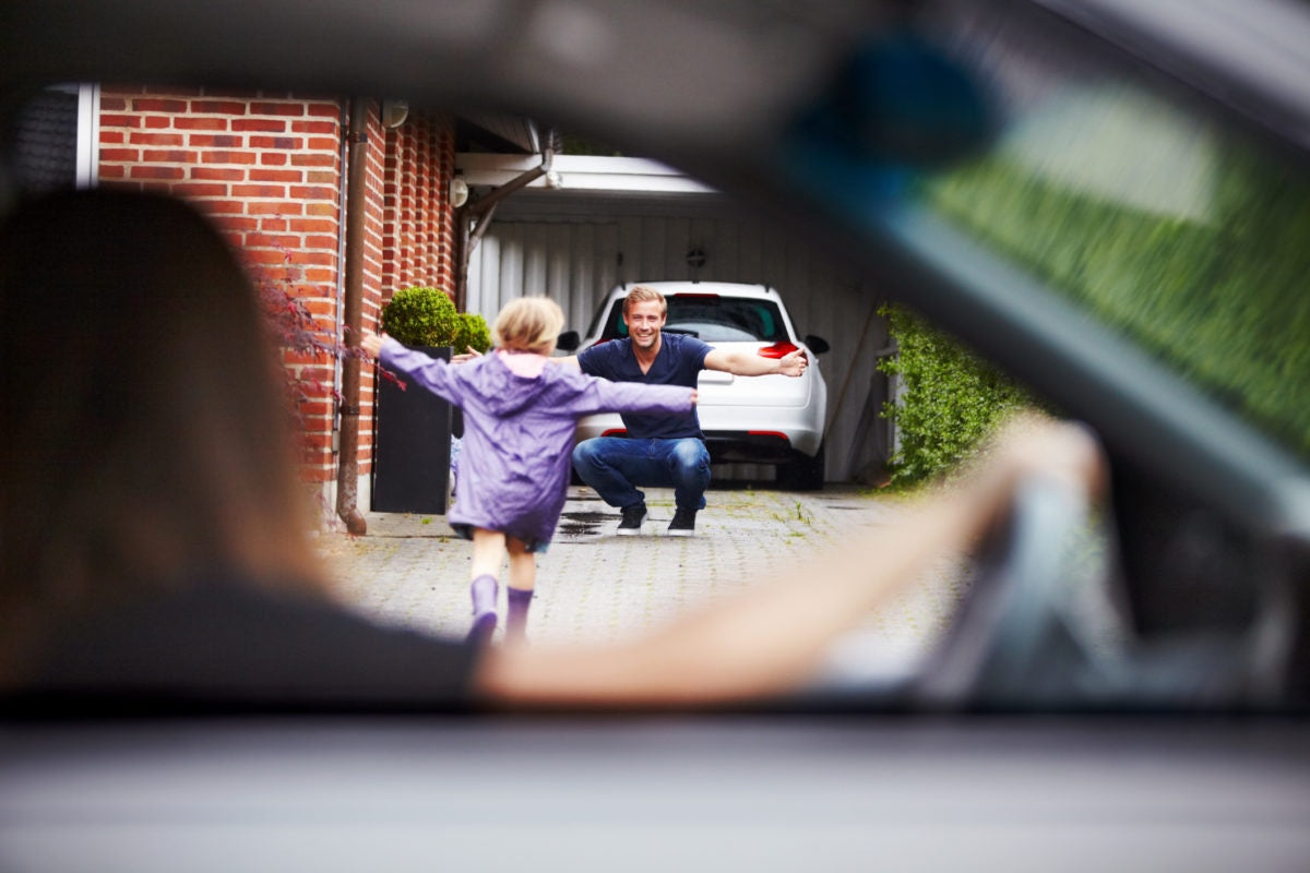 Car view : father going to hug child
