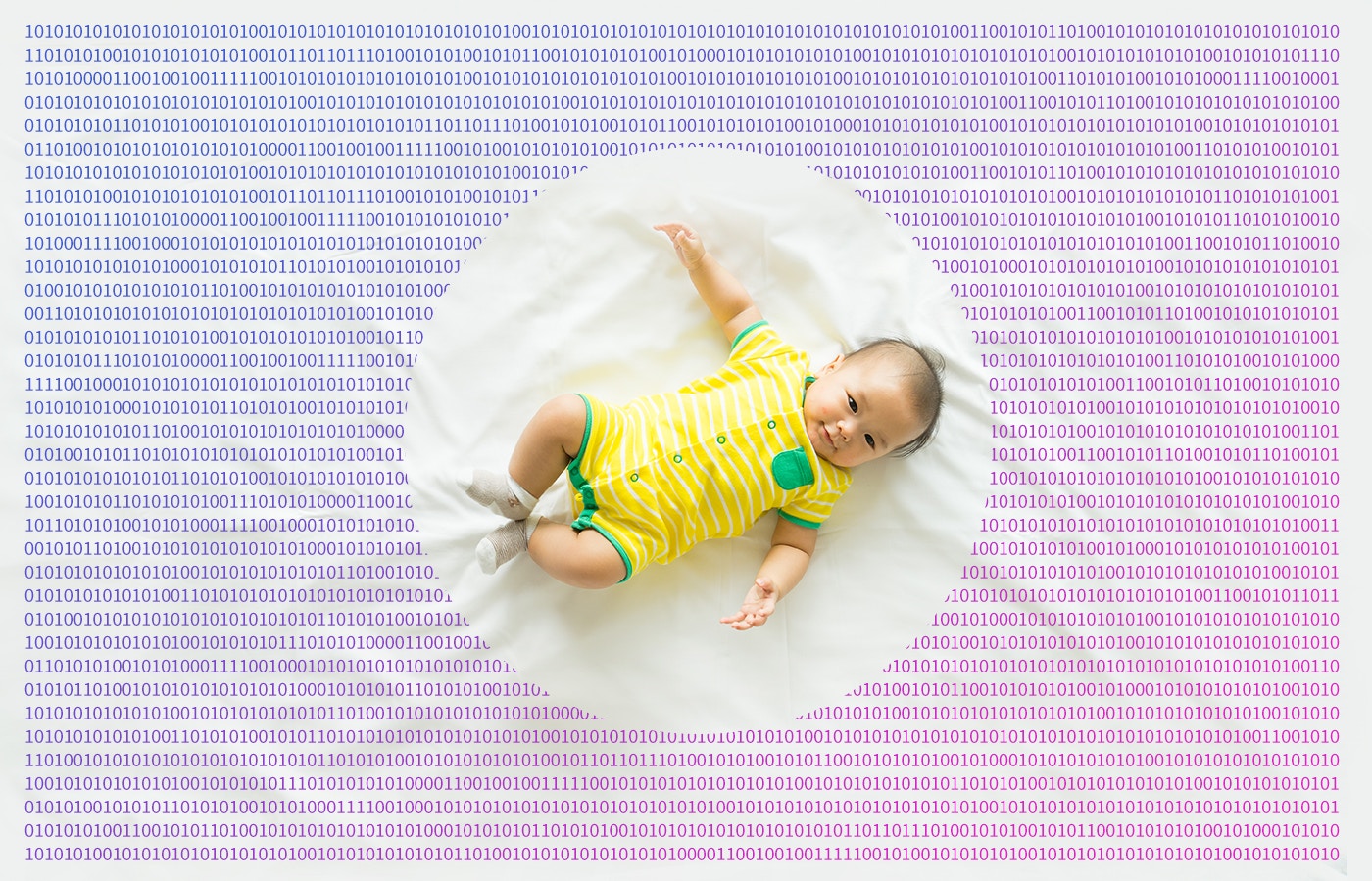 toddler in a bed sheet printed with binary digits