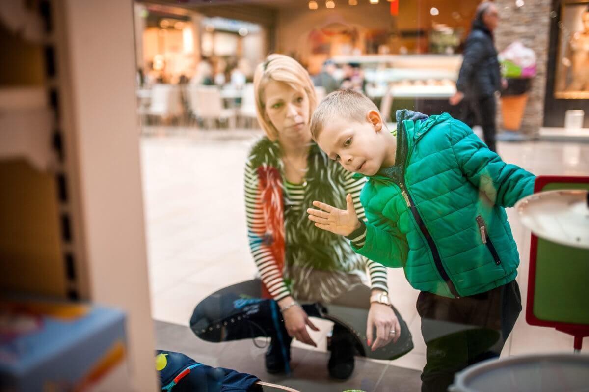 mom and son window shopping
