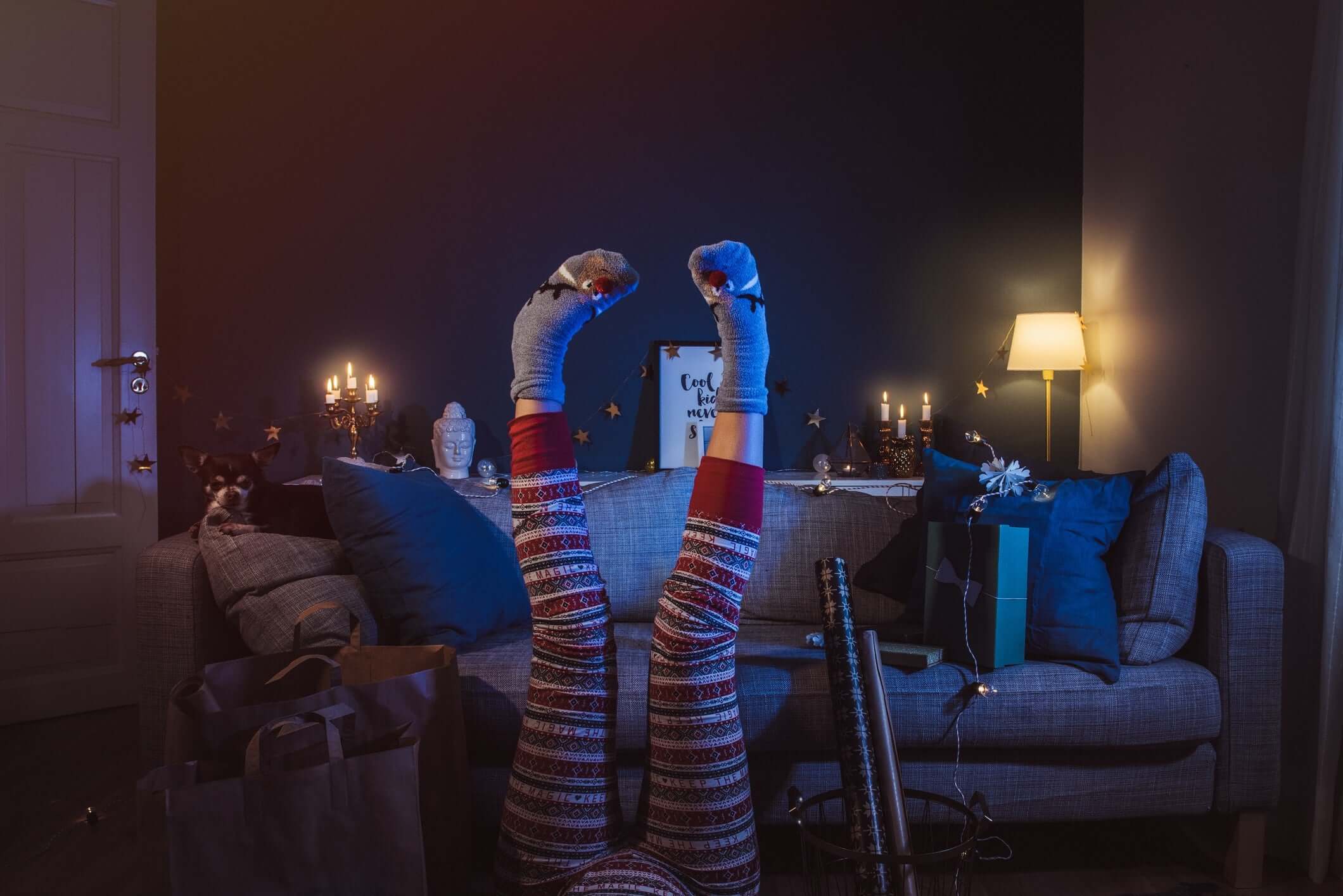 upside down image of women leg's wearing flowered maroon pants and grey socks