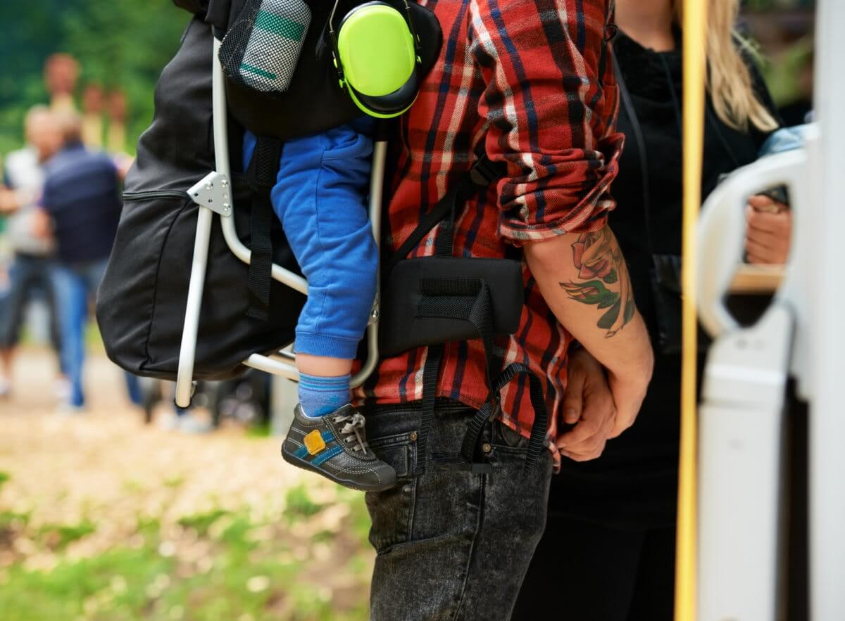 dad carrying baby on his back