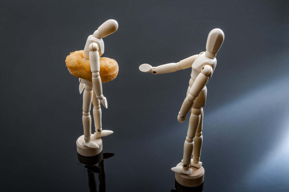 two wooden puppets on white background