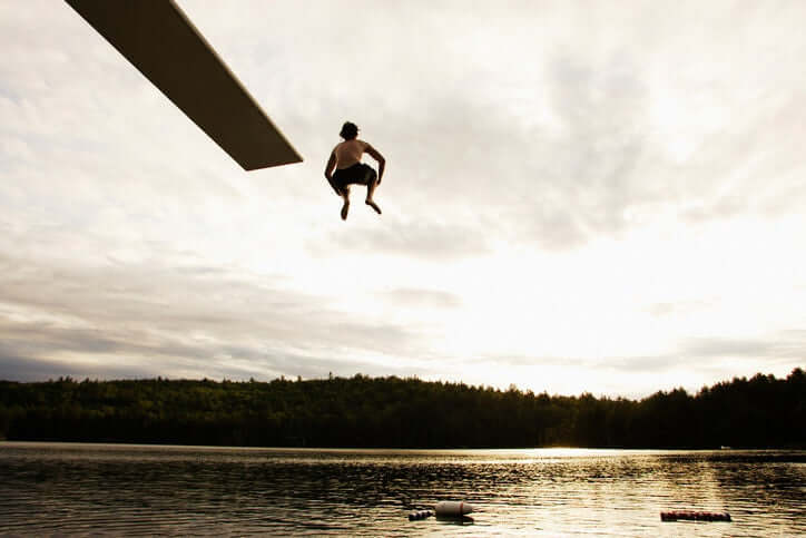 young man jumped into the water from a height