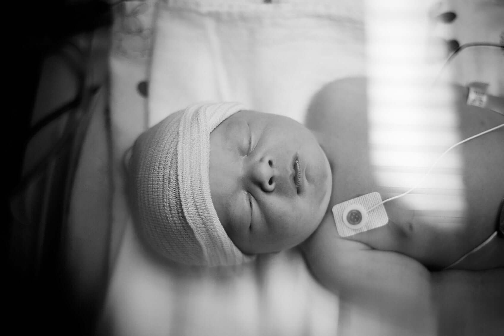 Newborn baby in incubator
