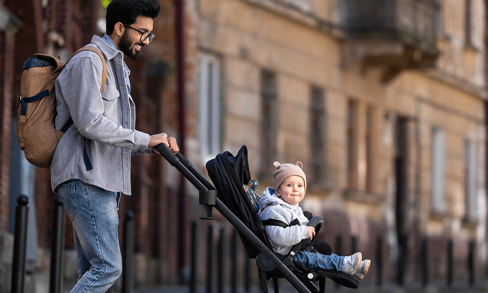 father with child on a stroller