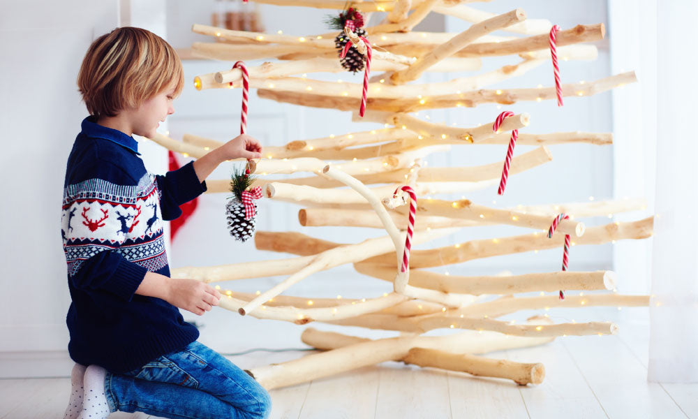kid decorate handcrafted christmas tree
