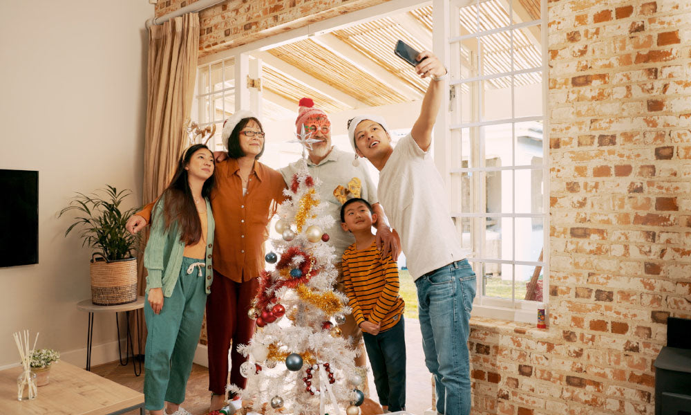 shot of a family taking a selfie during a christmas party