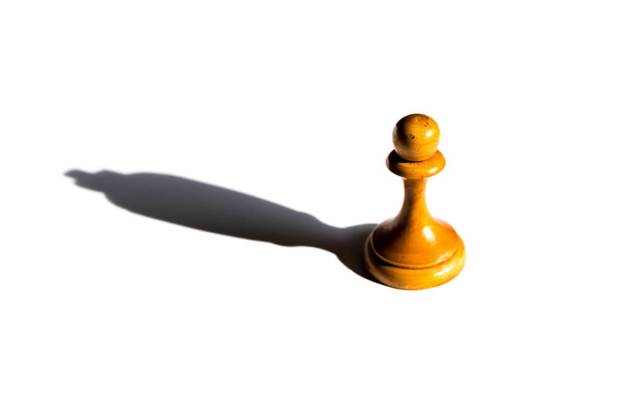 Chess Pawn Standing That Make A Shadow Of Queen