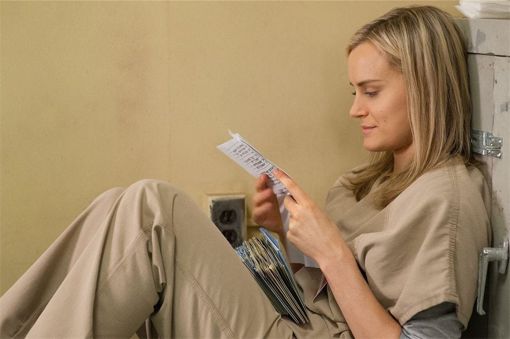 women from jail reading letters