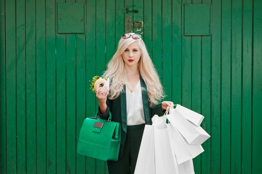 Happy young lady with shopping bags
