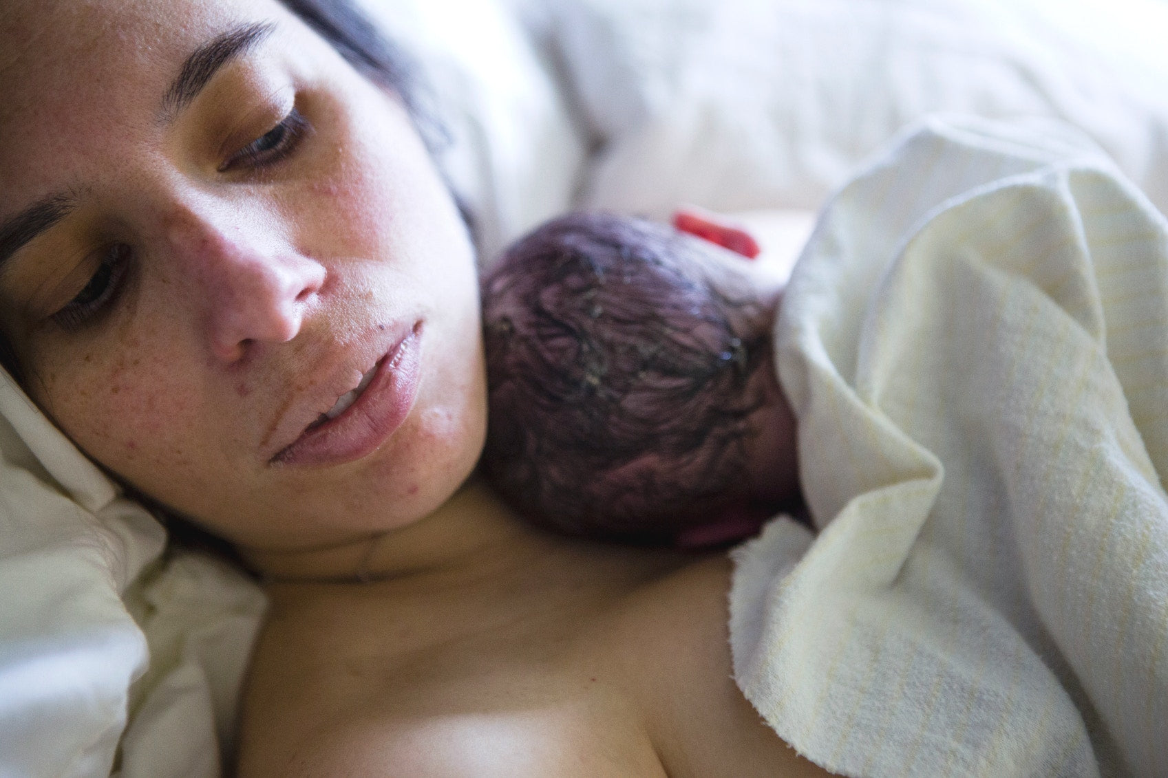 Women with New born child in her arms