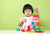little girl playing with building blocks