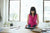 woman looking at ipad standing in office