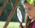 Child looking through magnifying glass