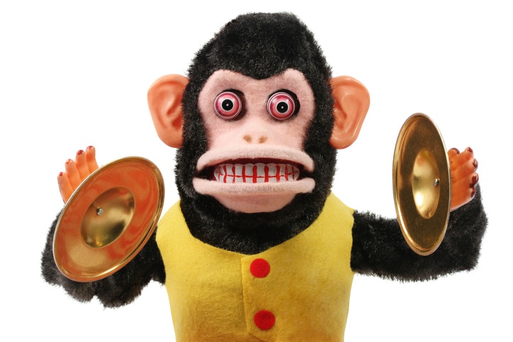 A monkey toy playing Cymbal