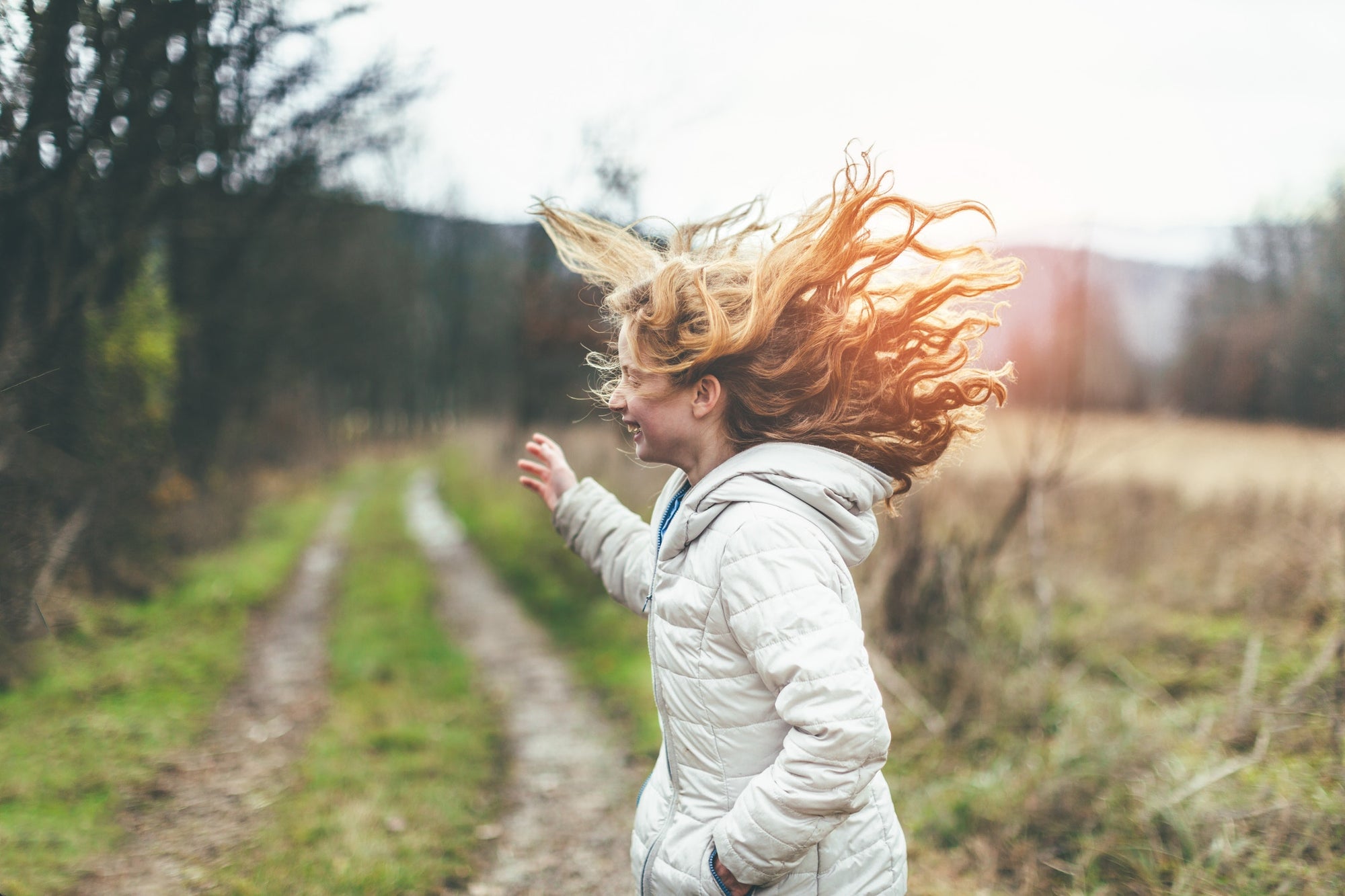 happy young girl with floating hair