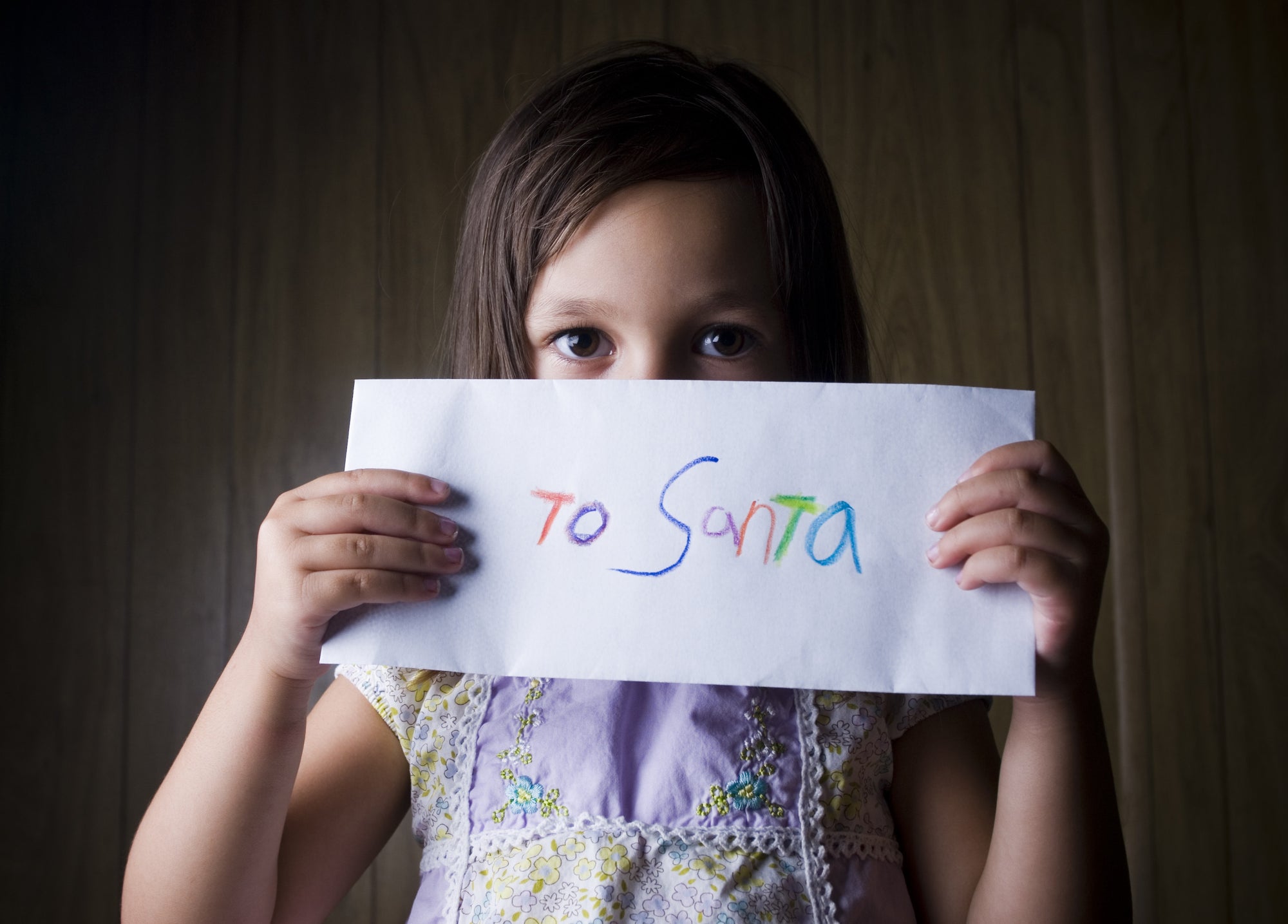 Little Girl Holding a Letter to Santa