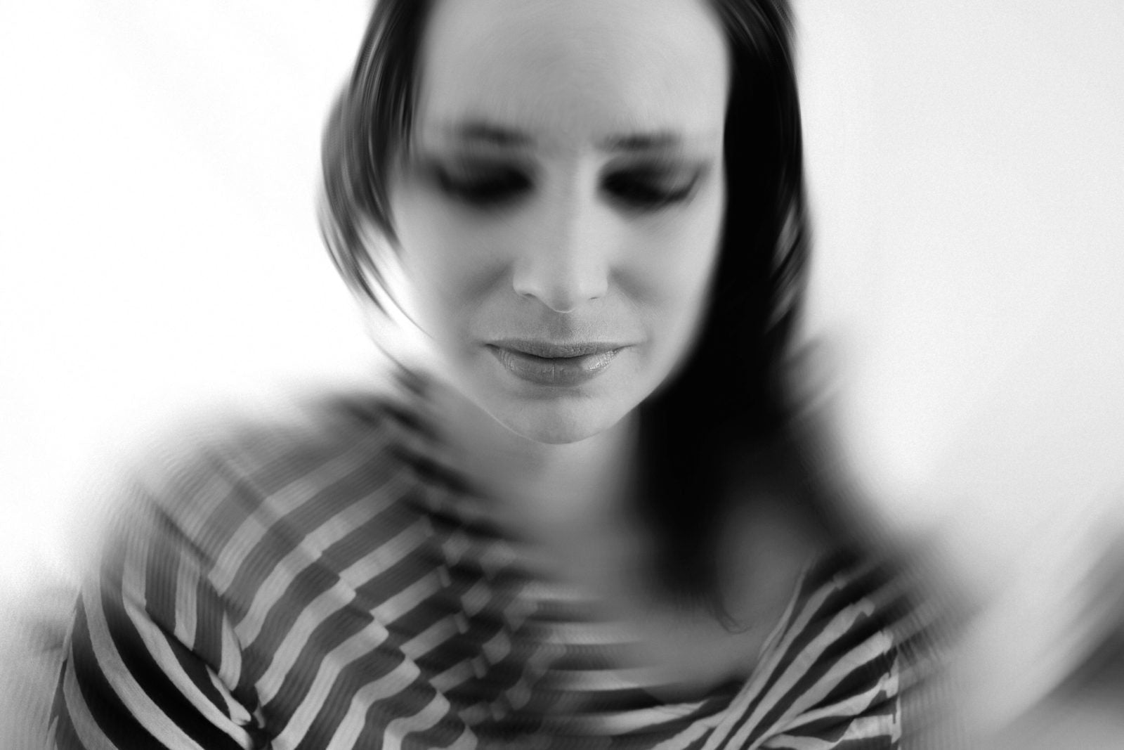blur image of a sad woman