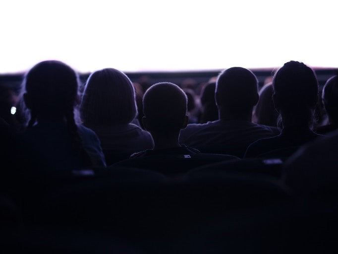 audience watching a movie in theatre
