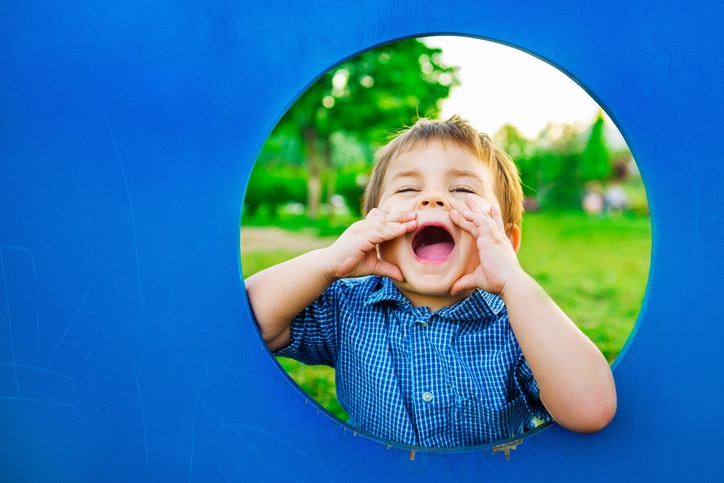 A child screaming from a circular window