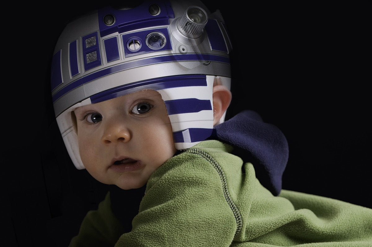 A baby wearing a helmet