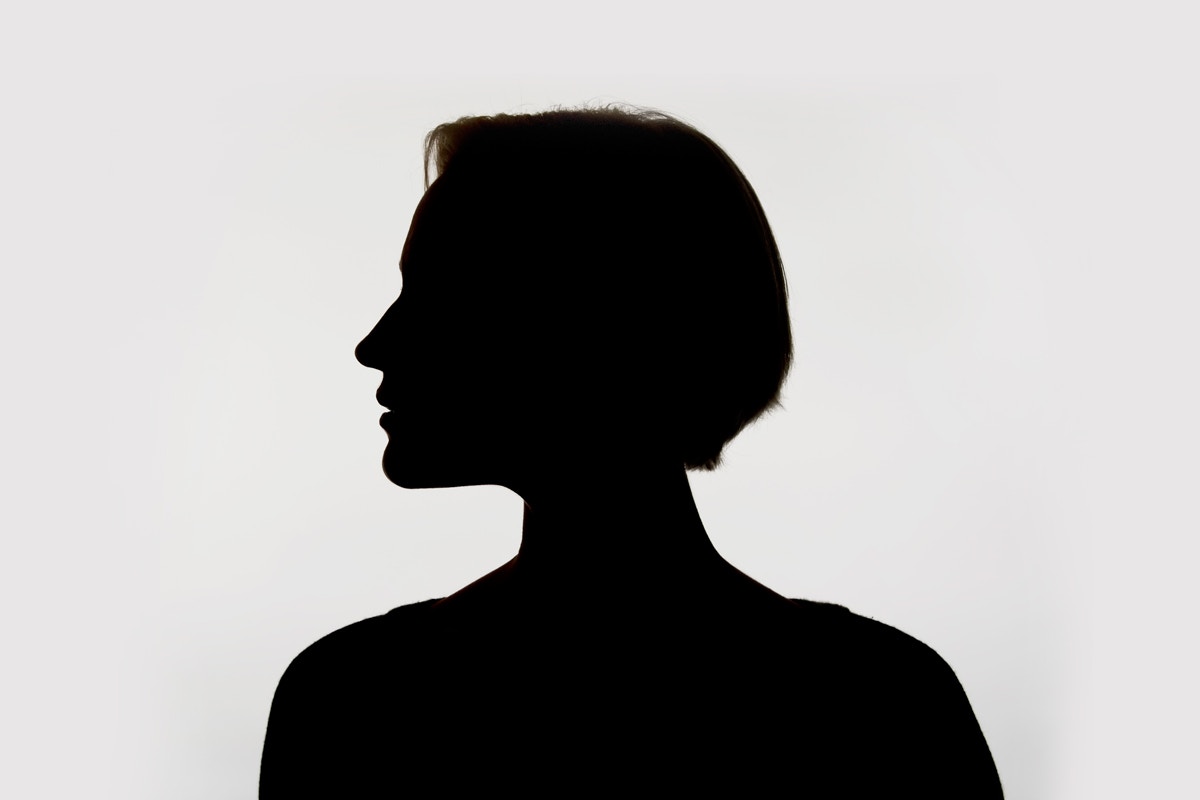 Silhouette of woman with short hair