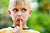 tensed little boy pushing his lower lip with finger