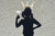 shadow of a girl with a crown and holding lollipop on a road 
