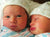 newborn twins wearing tricot hats