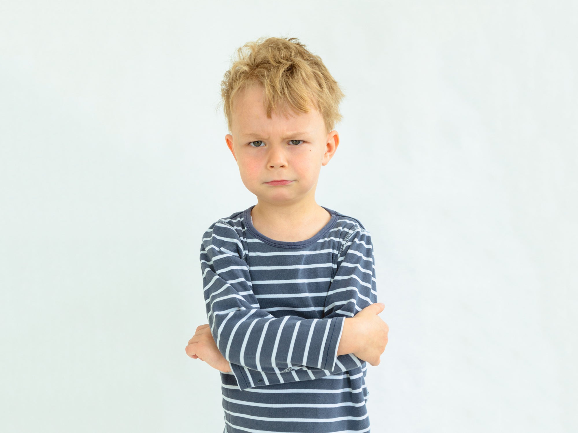 angry boy with arms crossed