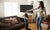 Mother and daughter dancing together in living room