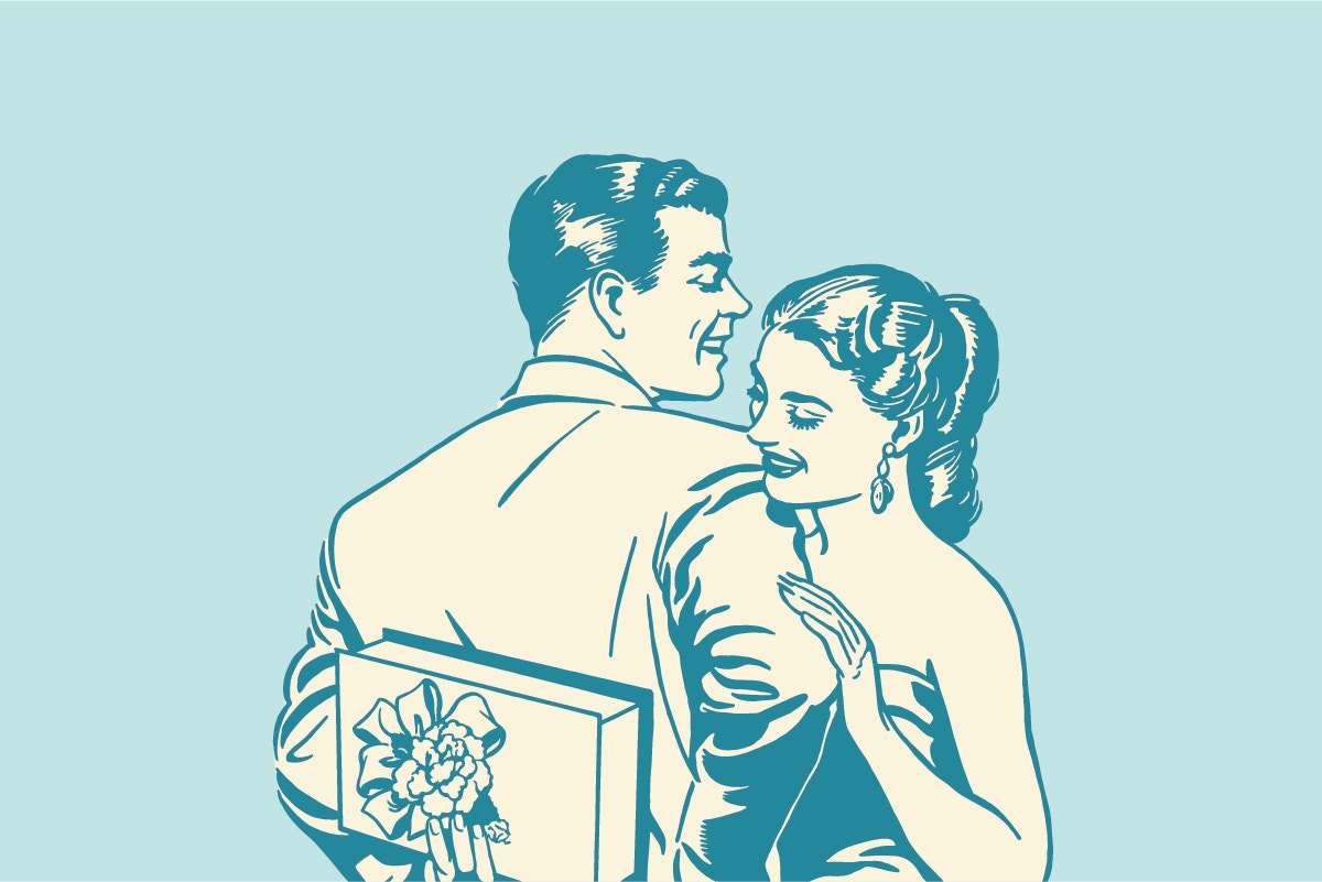 Rear view of a man holding a gift with a woman looking at gift behing him