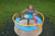 child spinning on playground roundabout