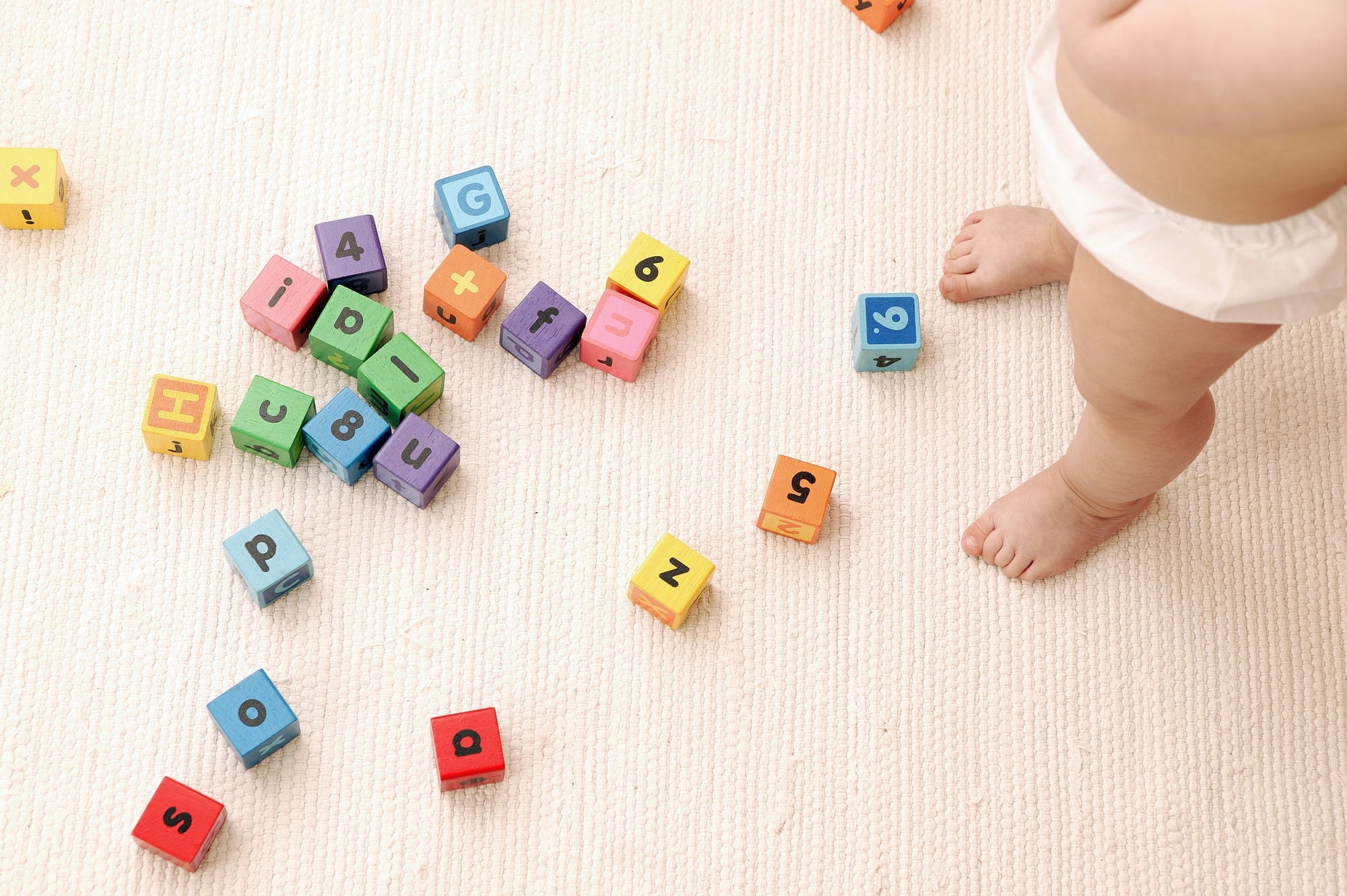 toy cubes with numbers and alphabets