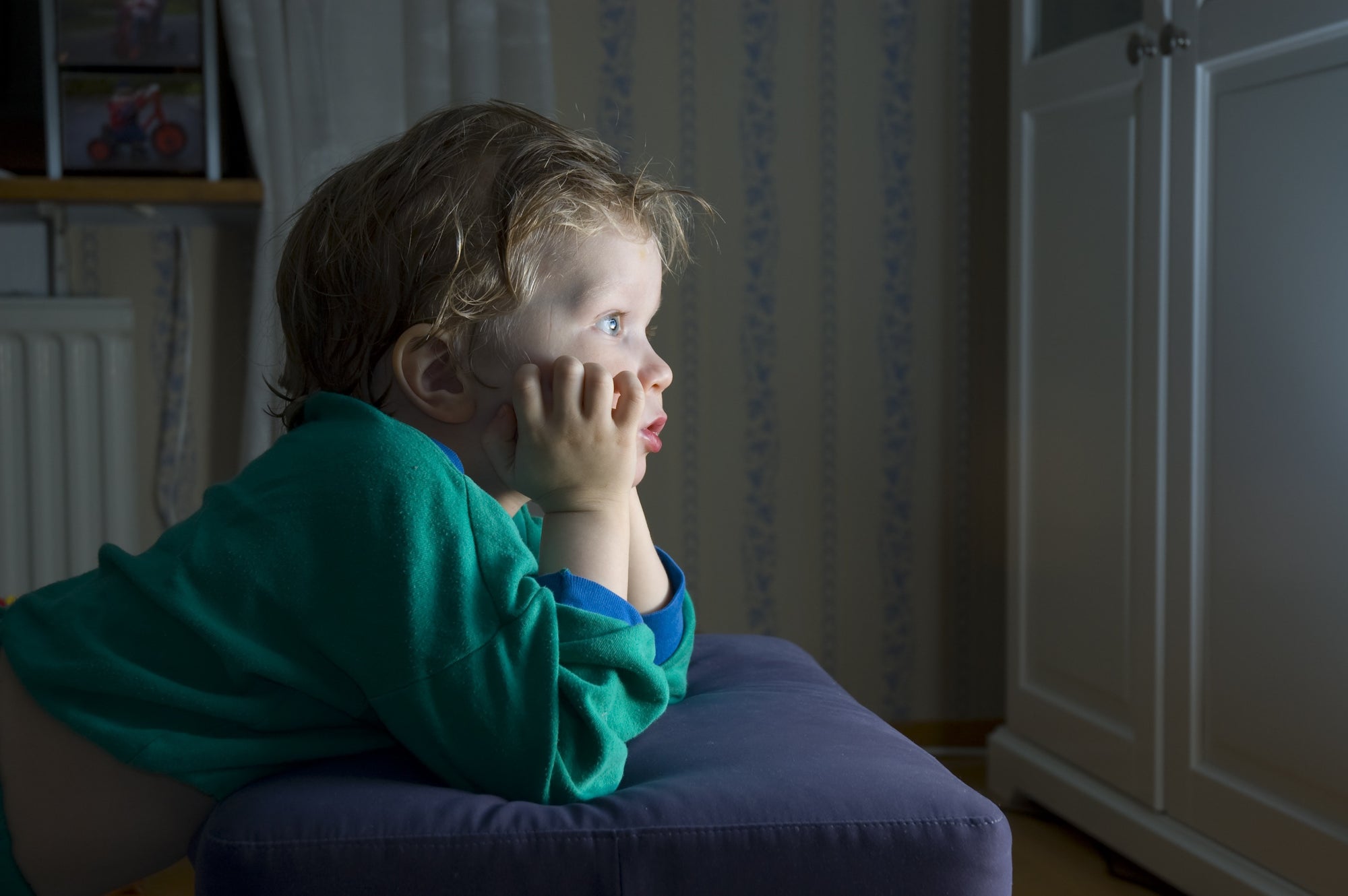 boy watching tv at night