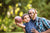 A kid is showing something to his father by holding a soccer