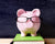 Piggy bank wearing spectacle