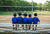 little boys sitting on bench in school ground