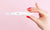  woman hand holding pregnancy test
