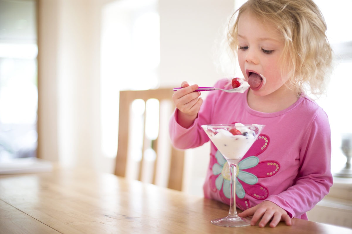 A girl is eating icecream