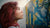lady with red hair standing and staring at the painting on the wall