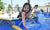 Child on a water park , splashing water fro pool